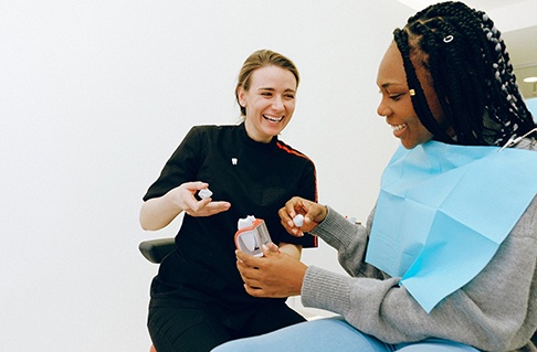 Dentist discussing dental crown with patient