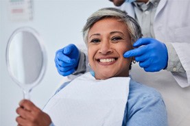 A senior woman getting a dental checkup